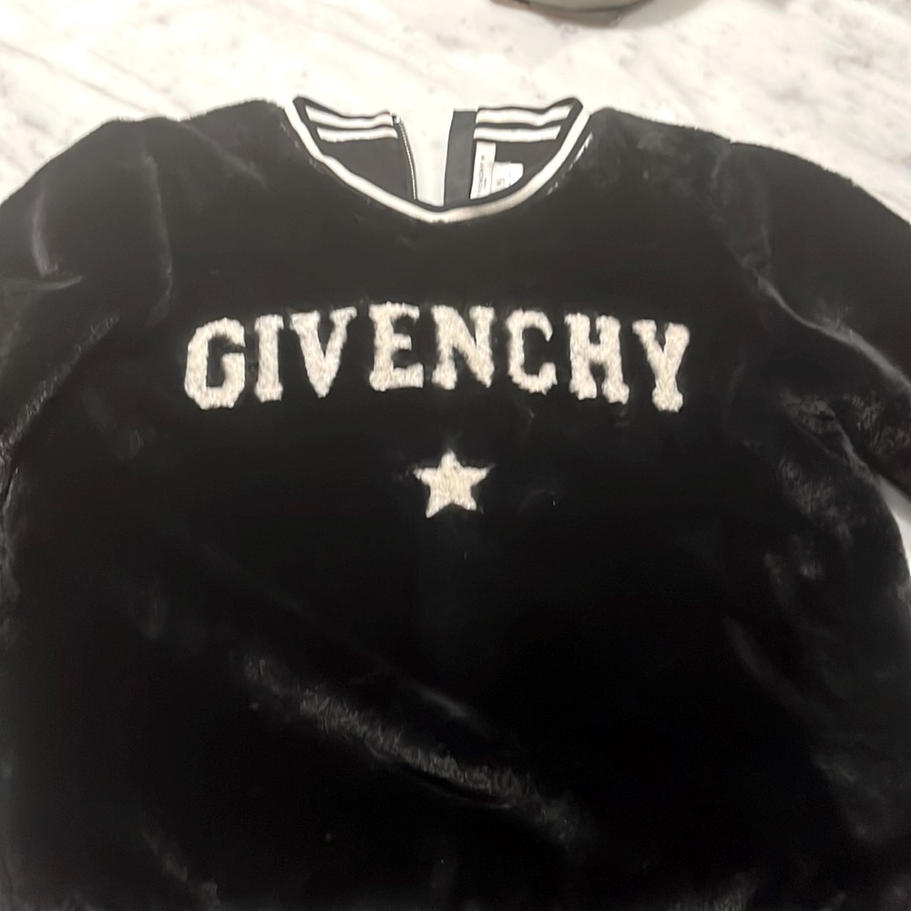 Black faux fur sweater great for winter , in great condition , worn twice .